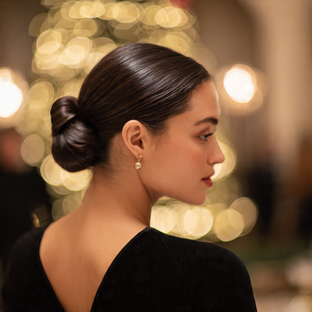 Sleek low bun Christmas hairstyle idea